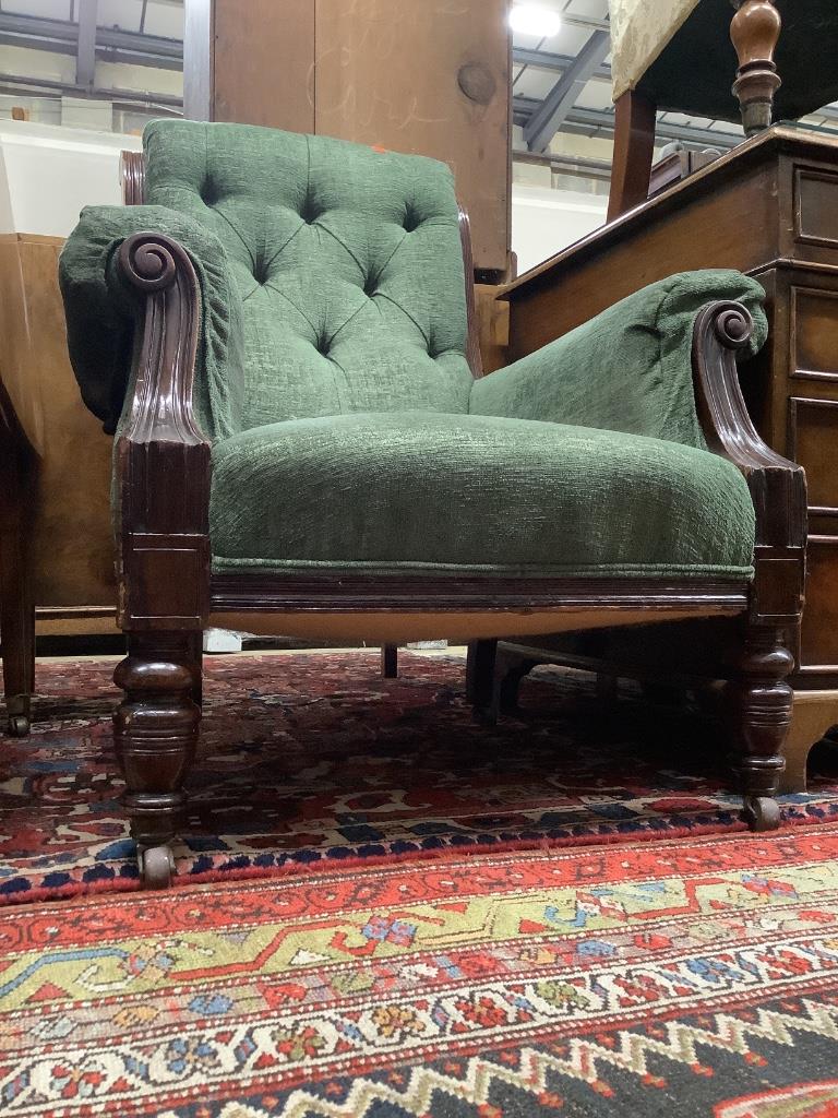 A Victorian mahogany framed armchair, in pale blue upholstery